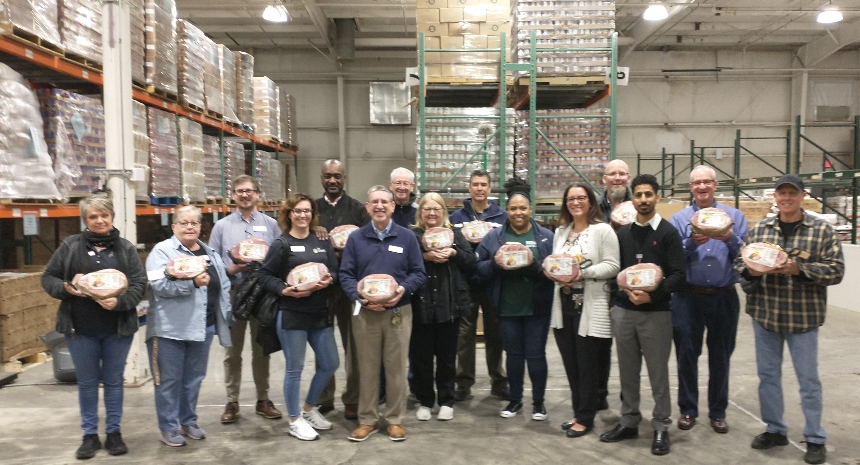 Giant Food's local store management and human resources team visited the Fredericksburg Regional Food Bank to celebrate the donation of 500 Easter hams. 